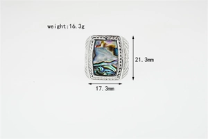 Detailed view of vintage men's ring featuring a rectangular abalone shell and engraved patterns