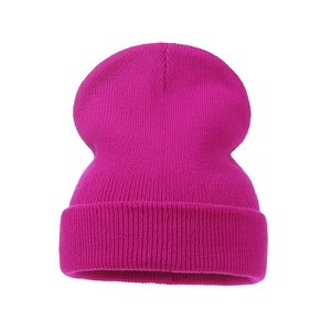 Close-up detail of rose pink ribbed knit beanie hat with elastic fold-over cuff design