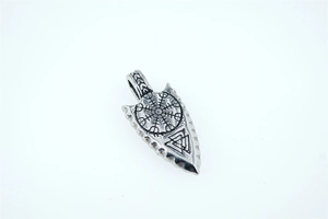 Detail of Viking arrow pendant with Aegishjalmur and Valknut symbols on aged steel