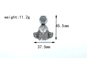 Macro detail of silver Viking helmet pendant with chainmail texture and dimensions