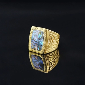 Vintage gold ring with rectangular colorful abalone shell inlay and carved relief detail