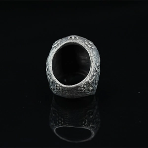 Vintage oxidized silver skull ring with gothic crown engraving and industrial style