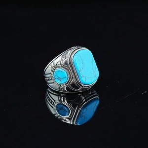Vintage boho turquoise ring with geometric ethnic engravings on silver-tone metal band