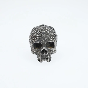 Vintage gothic skull ring with intricate baroque floral carvings in silver finish