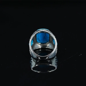 Retro ethnic silver ring with rectangular turquoise stone and engraved patterns