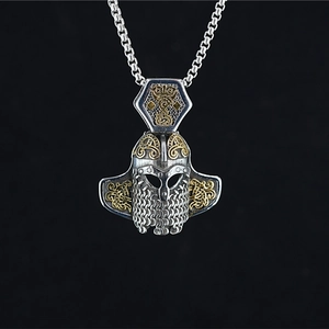 Vintage Viking warrior helmet pendant with gold knot patterns and chain mail beard details