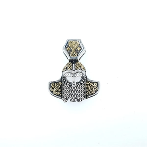 Retro Viking helmet pendant with gold scrollwork details and oxidized silver finish