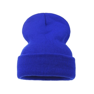 Detailed view of royal blue knit beanie with thick ribbed texture and wide folded cuff