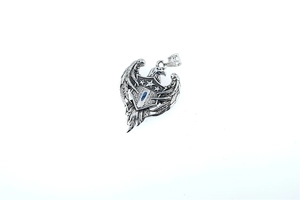 Detailed view of stainless steel eagle shield pendant featuring three stars and wings