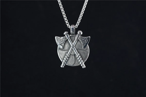 Detailed view of Viking double axe shield pendant with antique finish on steel chain