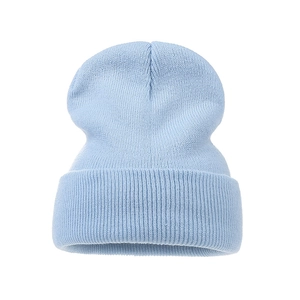 Detailed view of light blue knitted beanie featuring a classic ribbed texture and cuffed design