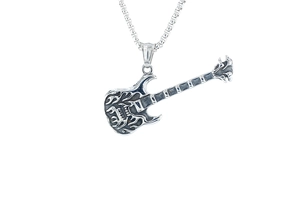Close-up of retro guitar pendant with skull flame patterns and vintage silver box chain