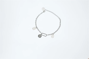 Detailed view of silver stainless steel chain with smiley face and engraved charms