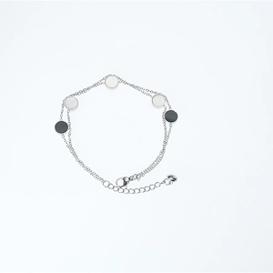 Minimalist double-layer silver steel bracelet with black and white disc sequins charms
