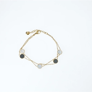 Double-layer gold titanium steel bracelet with round mother of pearl and dark stone charms