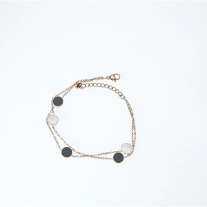 Double-layer rose gold titanium steel bracelet with alternating black and white round discs