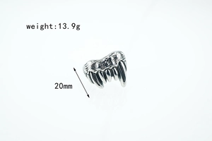 Close-up of gothic wolf tooth ring showing 20mm height and 13.9g weight in oxidized steel