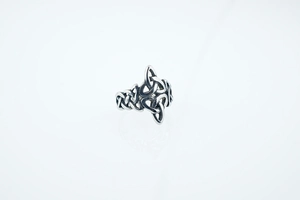 Detailed close-up of a vintage Viking Celtic knot pattern on a stainless steel ring
