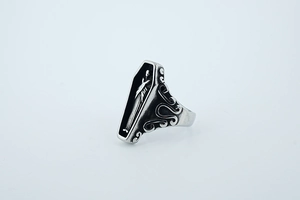 Detail view of gothic coffin ring with skull design and vintage oxidized finish