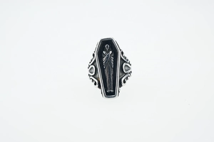 Detailed close-up of Gothic coffin ring with skeleton relief and scroll engraving
