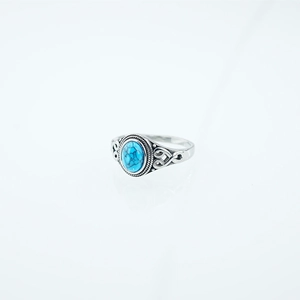 Vintage bohemian stainless steel ring with an oval turquoise stone and textured silver band