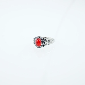 Vintage bohemian stainless steel ring featuring red oval stone and Celtic knot details