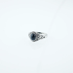 Vintage bohemian stainless steel ring featuring a black oval stone and filigree detailing
