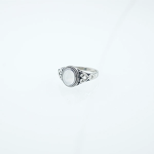 Vintage stainless steel ring with oval white gemstone and Celtic knot design details