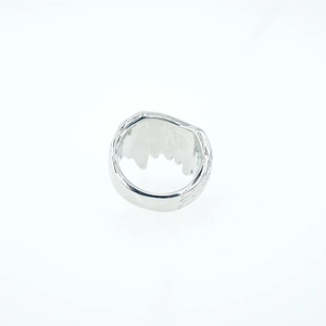 Gothic punk wolf fang ring in polished stainless steel with liquid lava texture design