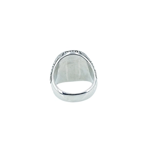 Vintage stainless steel men's ring featuring detailed wolf head carvings on a polished band