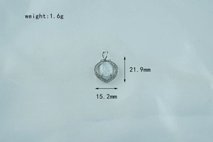 Macro detail of opal heart pendant in silver titanium steel with 1.6g weight info