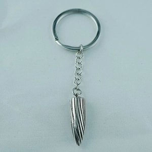 Men's bullet shaped titanium steel keychain with spiral industrial textures in silver