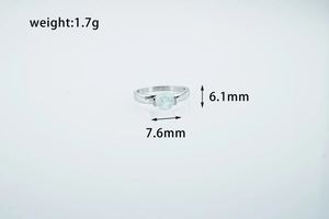 Detailed view of ocean blue opal ring showing 1.7g weight and 7.6mm x 6.1mm dimensions