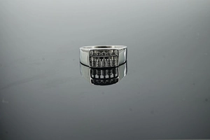 Detail shot of vintage stainless steel abacus ring with movable beads and polished finish