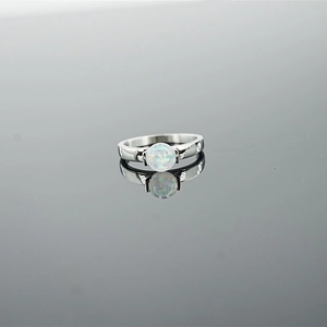 Minimalist ring featuring round white opal stone on polished silver stainless steel band