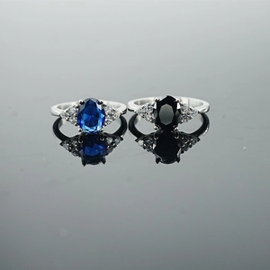 Exquisite oval sapphire and onyx rings in silver finish with side diamond accents