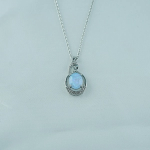 Exquisite titanium steel necklace featuring a water drop opal pendant with zircon accents