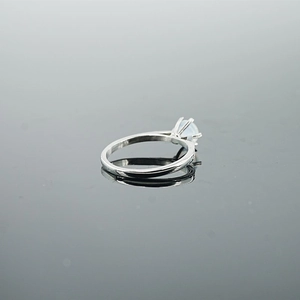 Minimalist silver steel ring with round light blue opal stone in classic six-prong setting