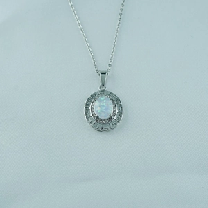 Elegant titanium steel necklace featuring a white oval opal pendant with Greek key pattern