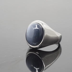 Vintage stainless steel ring with a large grey-blue cat eye gemstone in oval shape