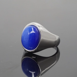 Polished stainless steel ring featuring a large oval blue cat's eye stone for men and women