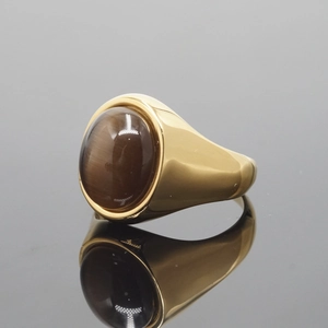 Vintage gold stainless steel ring featuring a large oval brown tiger eye gemstone