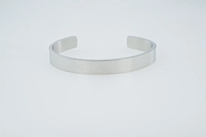 Detailed view of wide mirror-polished silver stainless steel adjustable open bangle