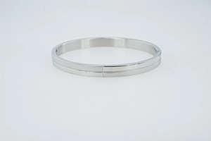 Detailed view of 8mm wide stainless steel bangle with central horizontal groove design