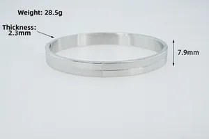 Macro detail of 8mm silver stainless steel bangle showing 2.3mm thickness and 7.9mm width