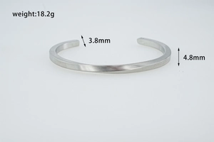 Detailed view of silver Mobius twist cuff bracelet with 18.2g weight and brushed finish
