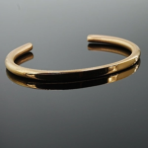 Polished gold minimalist C-shaped stainless steel open cuff bracelet with reflection