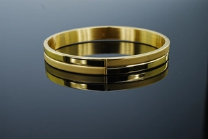 Detail view of 8mm gold stainless steel bangle with polished and frosted matte finish texture