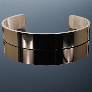 Polished gold adjustable open bangle bracelet with mirror finish and brushed inner texture