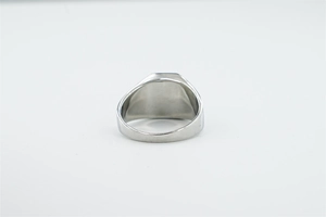 Detailed back view of a wide silver titanium steel ring with high-polished mirror finish